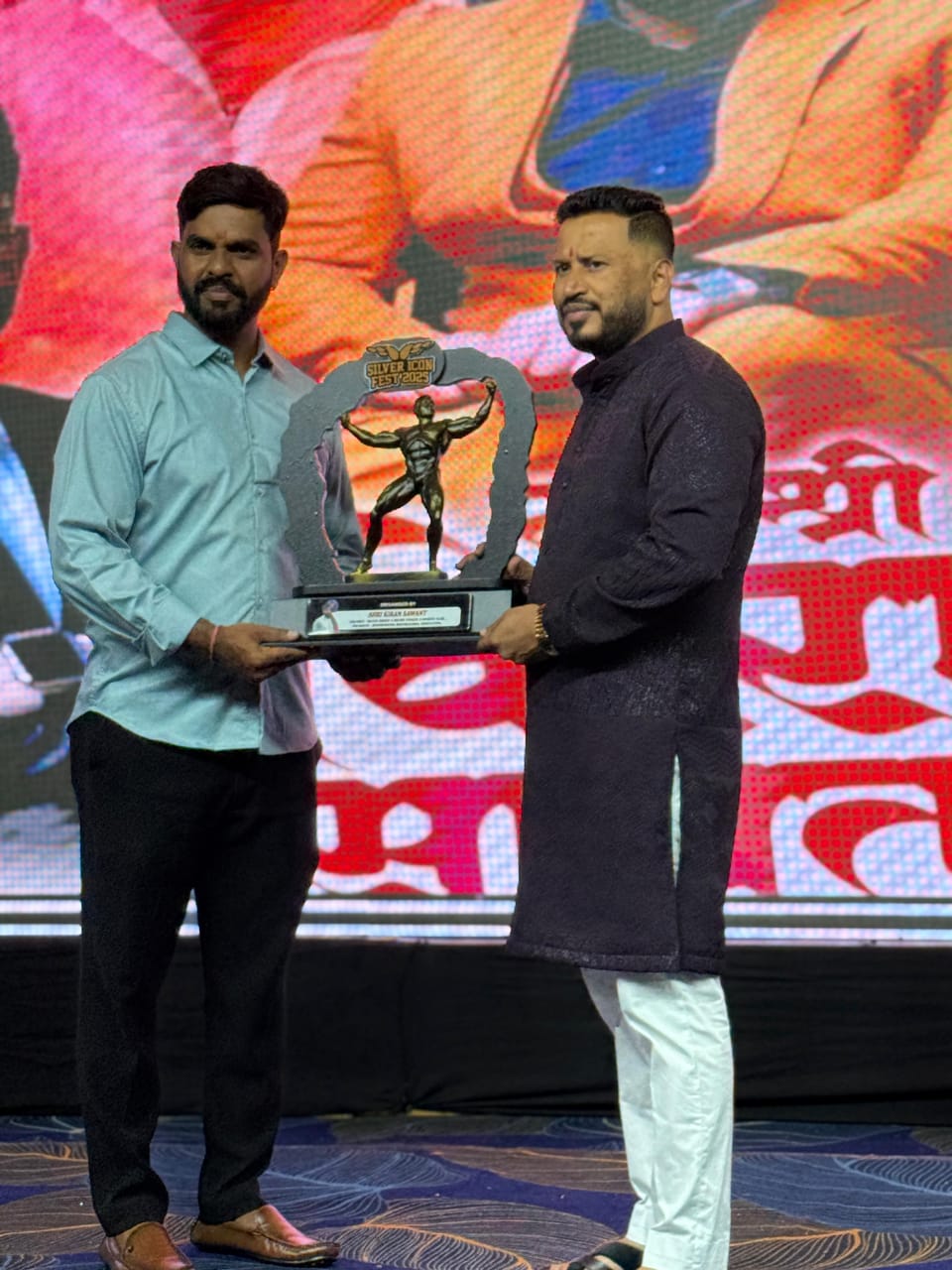 Abhishek Tanpure receiving an award at Silver Fitness Club